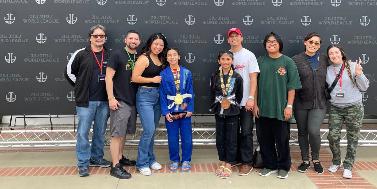 Jiyu coaches, families and two medal-winning students at a Jiu Jitsu World League tournament